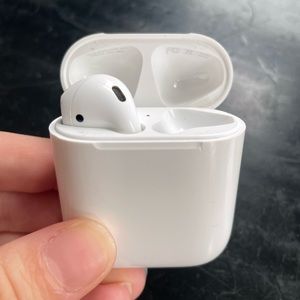 Left Gen 1 Airpod with Charging Case and Unused Charging Cord